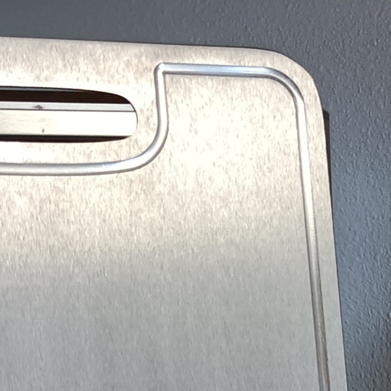 Close-up of the titanium surface and handle design