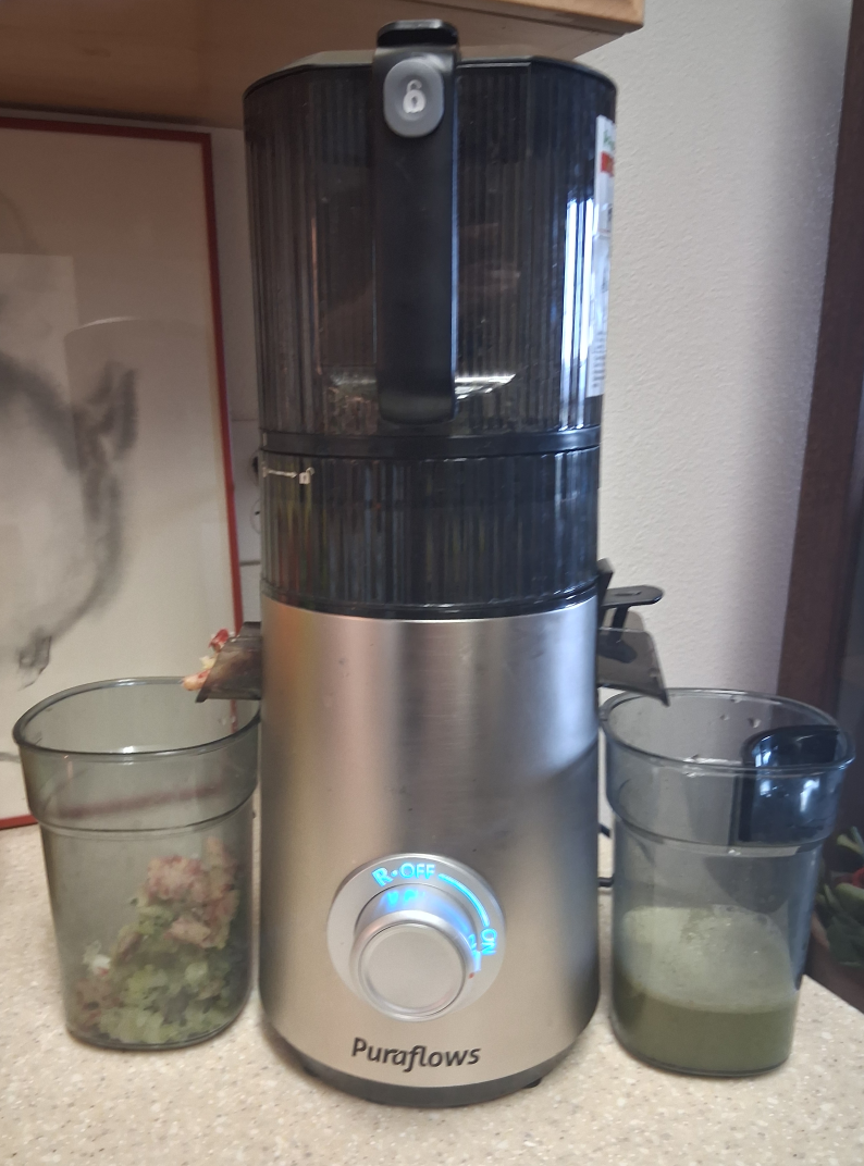 Puraflows Auramist Cold Press Juicer actively juicing produce during hands-on testing