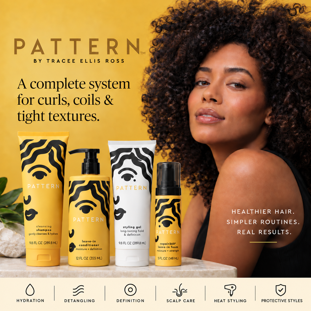 Woman with voluminous natural curls beside PATTERN Beauty haircare products
